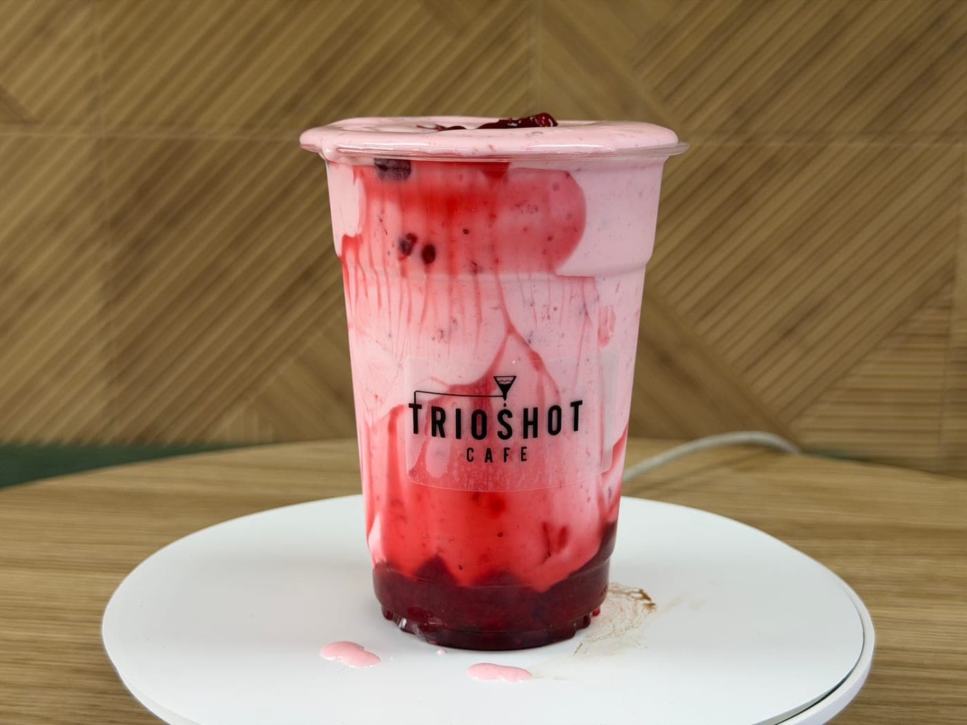 Strawberry cream iced drink in a TRIOSHOT CAFE cup