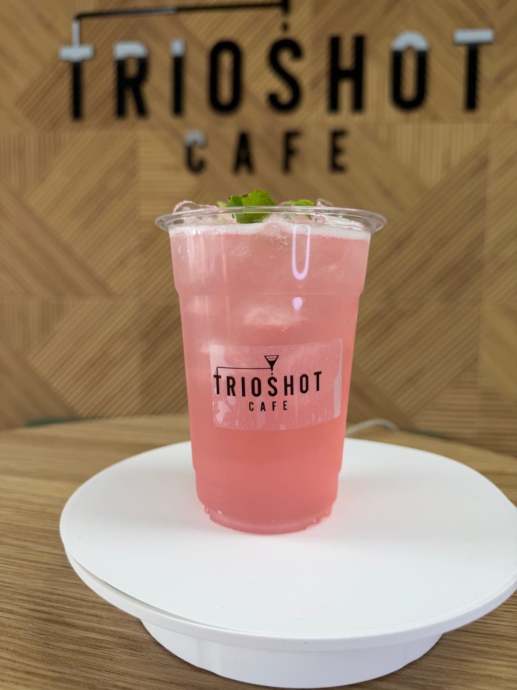 Pink strawberry refresher in a clear TRIOSHOT CAFE cup